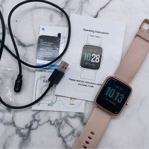 Smartwatch with Rose Gold Tone Pink Silicone Strap Turns On